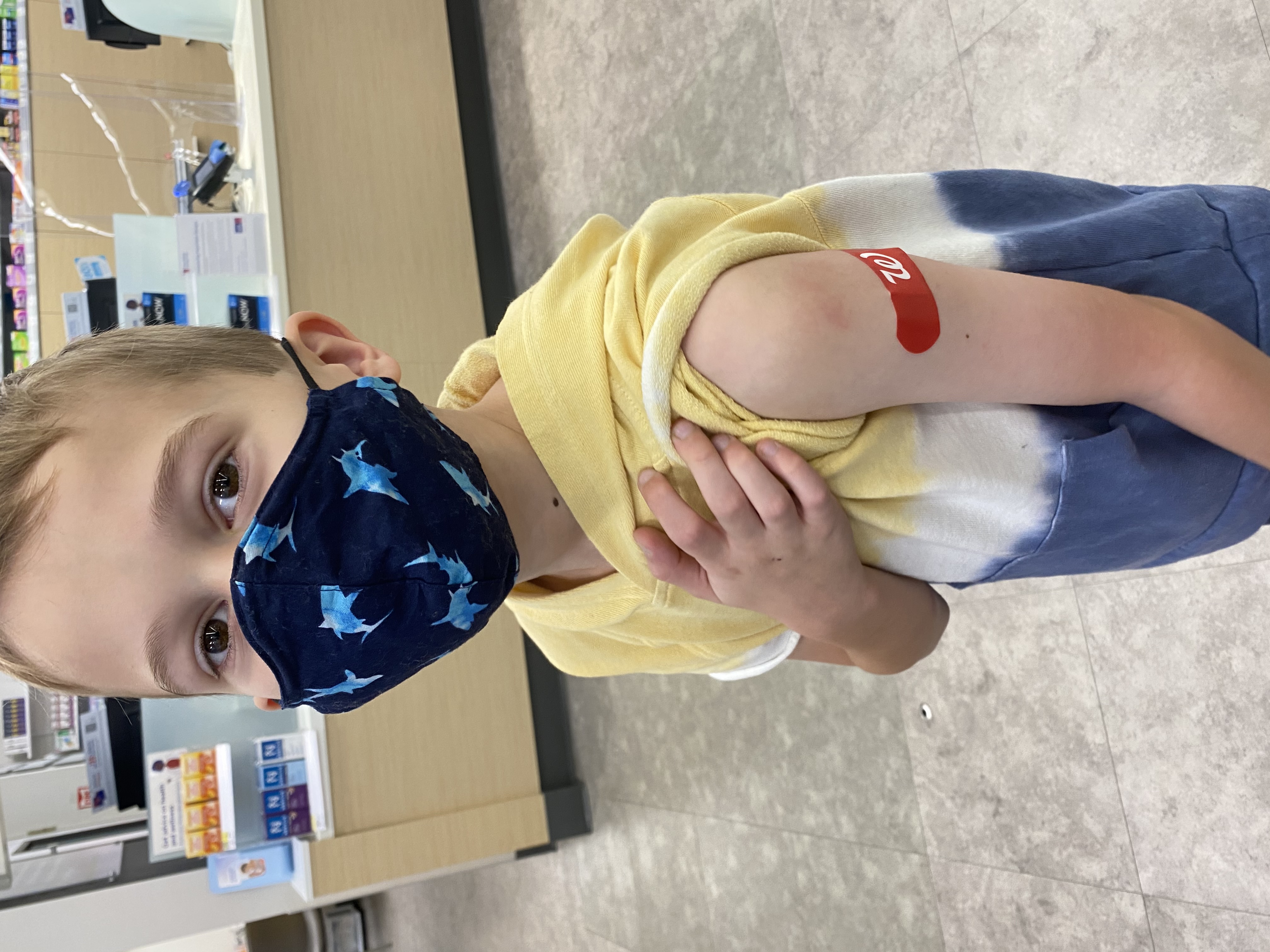 A boy age 5-11 with mask after vaccine
