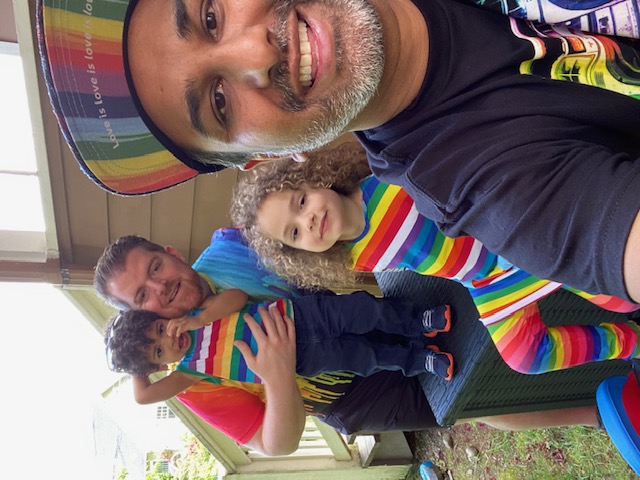 family in pride clothes