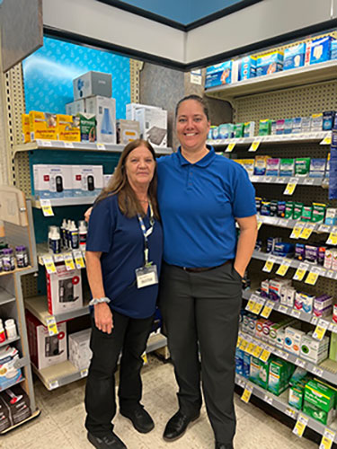 store manager and team member smiling